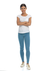 Fototapeta premium Positive casual woman holding her hands folded, standing