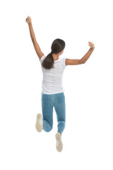 Back view of cheerful casual woman celebrating and jumping