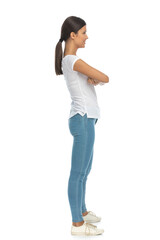 Side view of happy casual woman smiling with hand crossed
