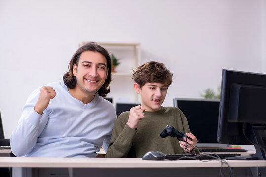 Father and son playing computer games