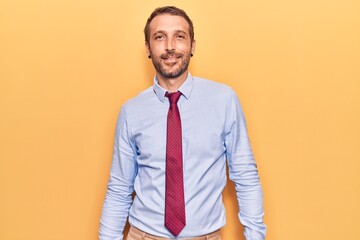 Young handsome man wearing business clothes looking positive and happy standing and smiling with a confident smile showing teeth