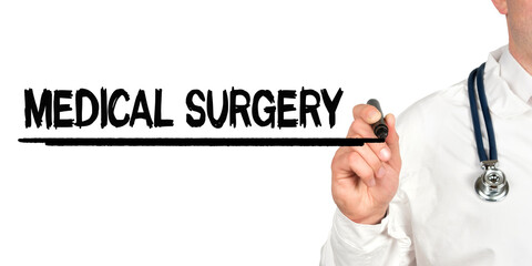 Doctor writes the word - MEDICAL SURGERY. Image of a hand holding a marker isolated on a white background.