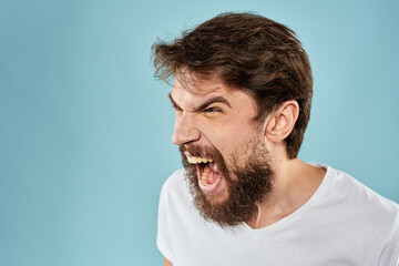 Bearded man emotions facial expression gestures hands close-up blue background