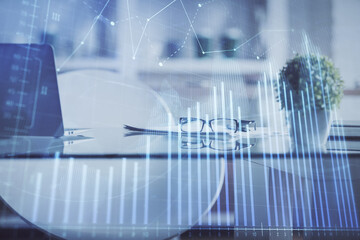 Double exposure of financial graph drawing and office interior background. Concept of stock market.