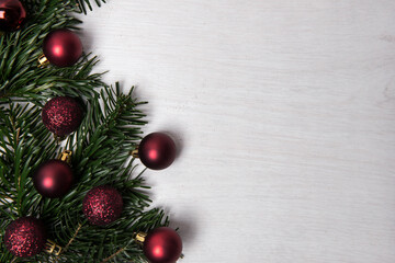 Festive Christmas background with baubles and pine branches