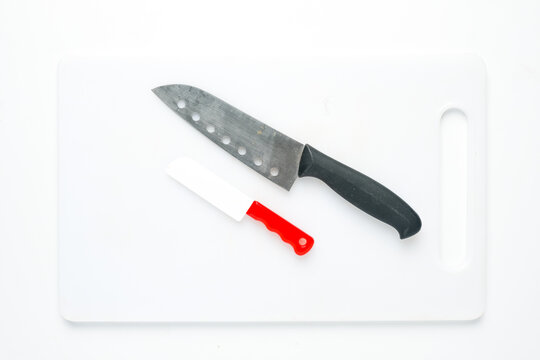 A picture of kitchen knife and toy knife on chopping board for my ambition concept.