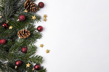 Festive Christmas background with baubles and pine branches
