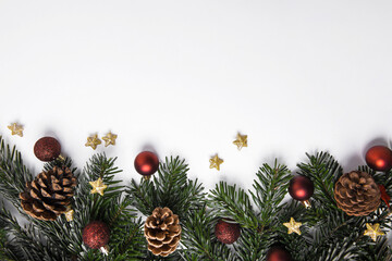 Obraz na płótnie Canvas Festive Christmas background with baubles and pine branches