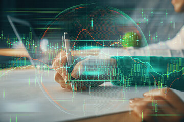 Double exposure of forex chart drawing over people taking notes background. Concept of financial analysis