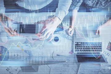 Double exposure of man and woman working together and financial chart hologram drawing. market analysis concept. Computer background. Top View.