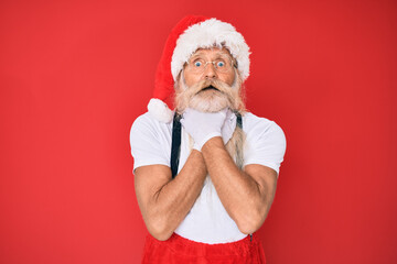 Fototapeta na wymiar Old senior man with grey hair and long beard wearing white t-shirt and santa claus costume shouting and suffocate because painful strangle. health problem. asphyxiate and suicide concept.
