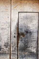 Old rusty metal door of a house