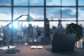Office interior with city view laptop computer