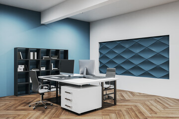 Contemporary office workplace with decorative blue wall.