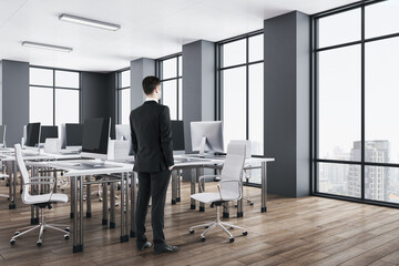 Businessman standing in luxury office