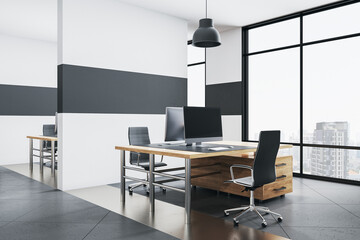 Modern office interior with rows of computer table.