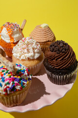 Cupcakes on Cake  Stand on Yellow Table