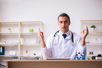 Young male doctor working in the clinic