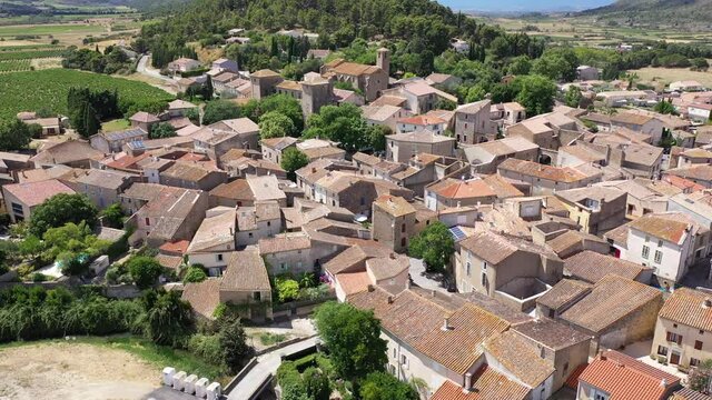 Scenic aerial view of French township of Fontcouverte at foot of Alaric mountain on sunny summer day, Aude, Occitanie