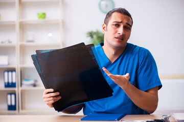 Young male doctor radiologist working in the clinic