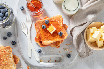 Homemade french toast with fresh berries and honey
