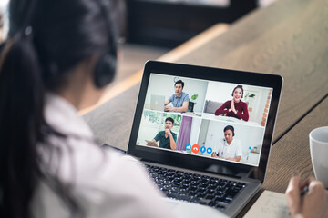 Fototapeta na wymiar Asian businesswoman working from home, making video conference meeting