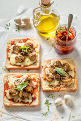 Tasty Toast with mushrooms, basil and cheese