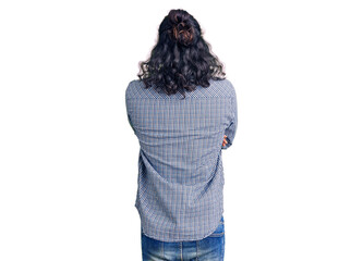 Young arab man wearing casual clothes standing backwards looking away with crossed arms