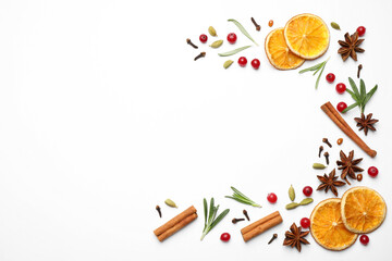 Different mulled wine ingredients on white background, flat lay. Space for text