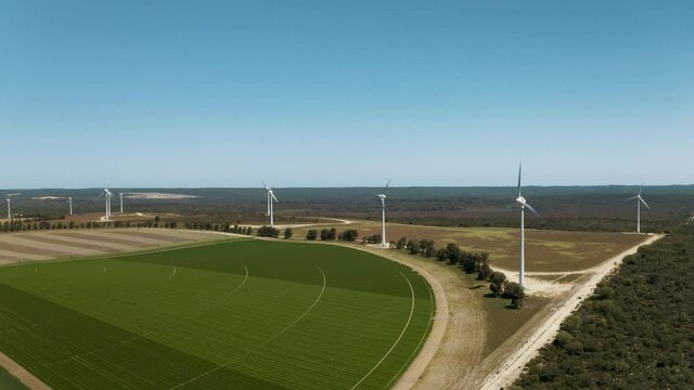 Wind Turbines in the Australian Outback. Aerial drone footage of wind turbine farm generating power. 
