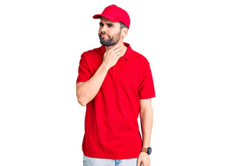 Young handsome man with beard wearing delivery uniform touching painful neck, sore throat for flu, clod and infection