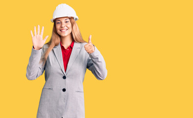 Beautiful young woman wearing architect hardhat showing and pointing up with fingers number six while smiling confident and happy.