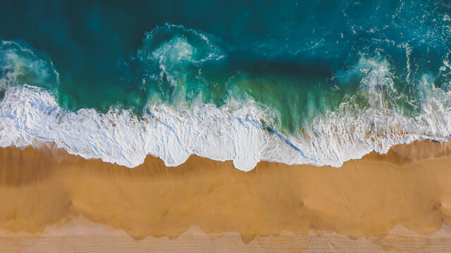 Picture in the air of the ocean, waves, and beach
