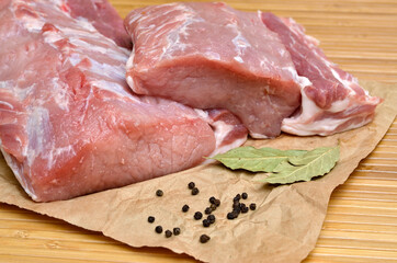 A piece of raw meat on a cutting kitchen table