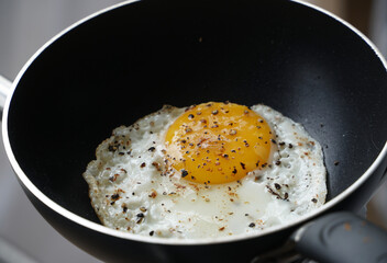 Fresh fried egg in a frying pan