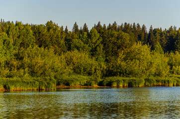 houses on the beach. Rural river in the early morning