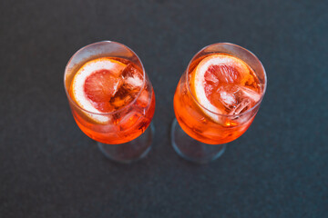 wine glasses with orange spritz cocktails on kitchen countertop