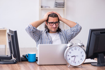 Young male it specialist working in the office