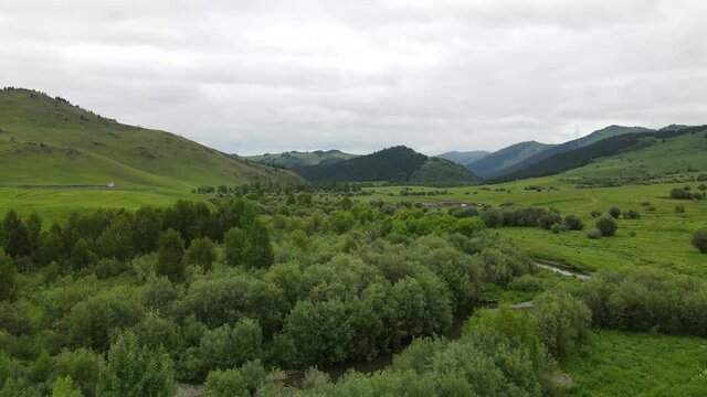Landscape East Kazakhstan Upper Katon Karagay. Drone 4K DJI Mavic Air2. River near mountains.
