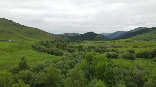 Landscape East Kazakhstan Upper Katon Karagay. Drone 4K DJI Mavic Air2. River near green mountains.