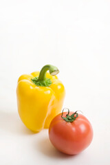 paprika and tomato on white background