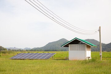 Solar cell panel installed in remote area for generating electricity from sun light to the house for living and agriculture shows alternative power to eliminate pollution for climate change