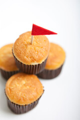pile of muffins with small flag