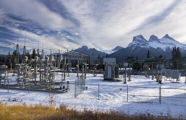 Electric Power Plant Facility in Rocky Mountains after early Snowfall.  City of Canmore, Bow Valley, Alberta Canada