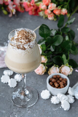 cold fresh ice coffee with chocolate, garnished with biscuit and sweets