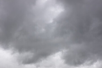 Obraz premium black and white storm clouds background. Light in the Dark and Dramatic Storm Clouds background, Dark clouds before a thunder-storm.