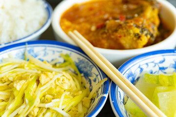 side view scrambled eggs with hotbed chives and deep fried fish and fuzzy melon with rice