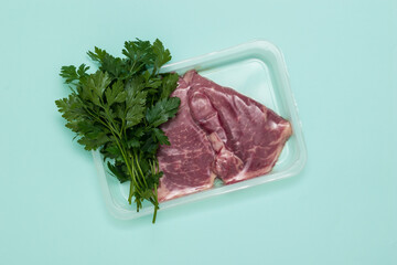 Two vacuum-wrapped beef steaks on a blue background.