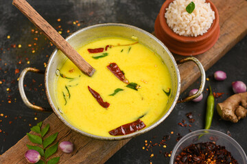 Bowl of homemade sour cream curd yogurt Dahi fresh herbs curry leaf Kerala, India. Dairy product...