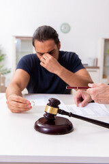 Lawyer talking to divorcing couple at home